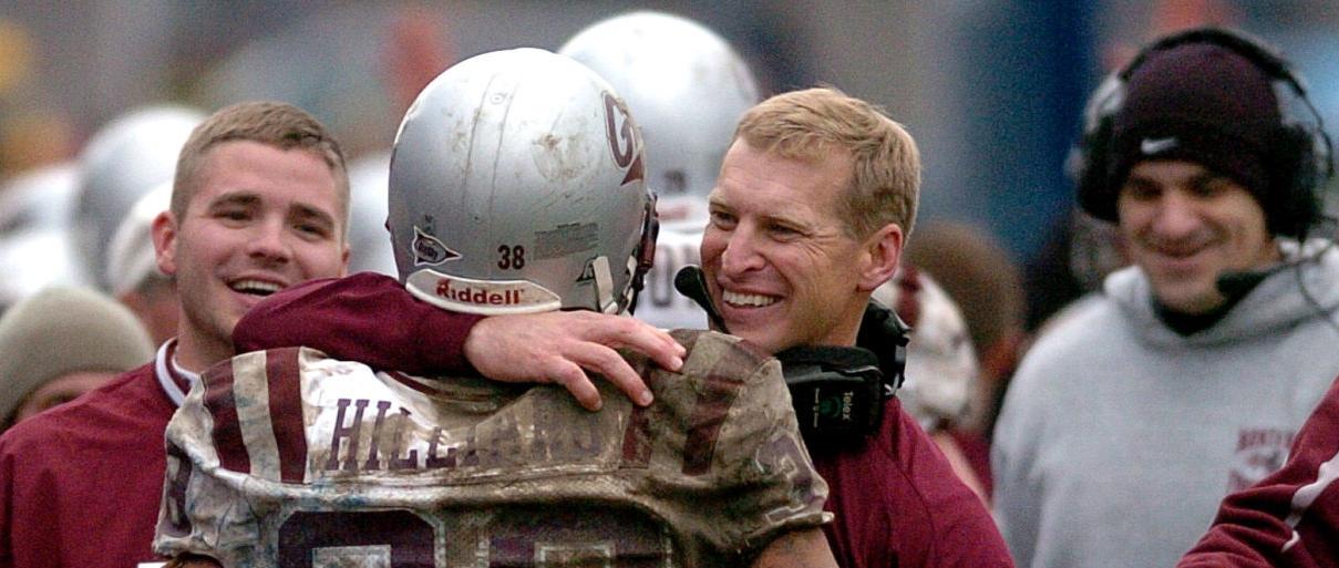 Former Montana coach Bobby Hauck celebrates a 2007 win over Montana State